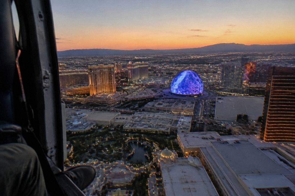 Resort towers and city lights seen from the air on a clear evening over Las Vegas