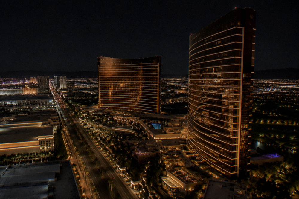 Night skyline of Las Vegas resort towers glowing above the city grid