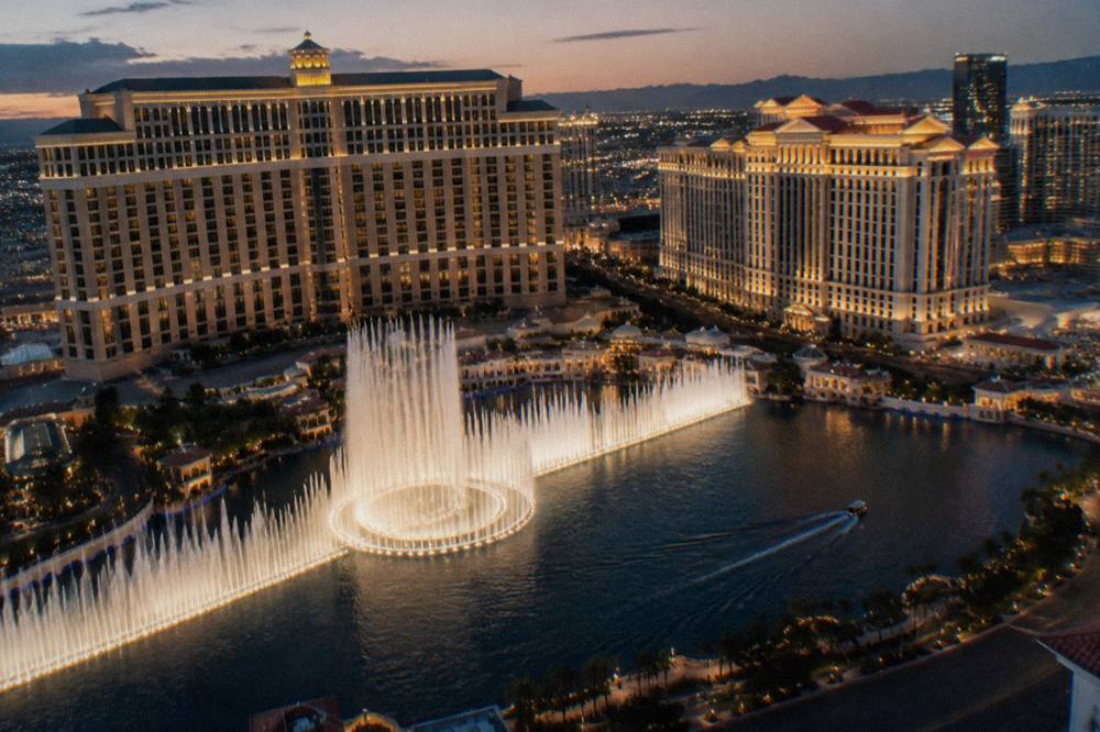 Night aerial view of glowing resort towers along the Las Vegas Strip