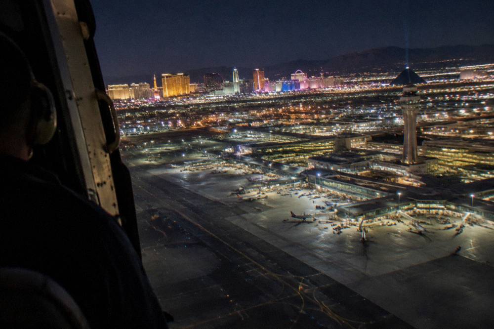 Resort towers and neon signs of the Las Vegas Strip seen from above at night