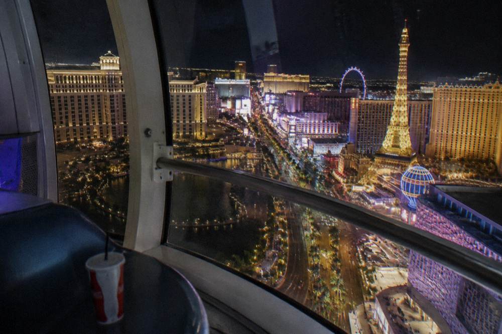 Night view from a High Roller cabin looking down the length of the illuminated Strip